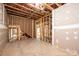 Unfinished basement area with framed walls, exposed ductwork, and staircase at 0 6Th Nw St, Hickory, NC 28601
