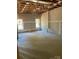 Unfinished basement with exposed ceiling, concrete floor, and natural light from two windows at 0 6Th Nw St, Hickory, NC 28601