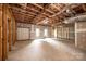 Expansive unfinished basement with windows, door and exposed ceiling duct work at 0 6Th Nw St, Hickory, NC 28601