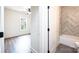 Bathroom doorway leading to a bedroom, featuring a tile shower and tub combination at 0 6Th Nw St, Hickory, NC 28601