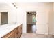 Bright bathroom features a double vanity and a doorway leading to the bedroom at 0 6Th Nw St, Hickory, NC 28601