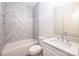 Well-lit bathroom featuring a tub and shower combination with elegant tile work at 0 6Th Nw St, Hickory, NC 28601