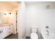 Bright bathroom with tile floor, granite countertop vanity and a shower-tub combo at 0 6Th Nw St, Hickory, NC 28601