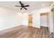 Bedroom with hardwood floors, ceiling fan, and access to a bathroom at 0 6Th Nw St, Hickory, NC 28601