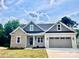 Charming single-Gathering home with a two-car garage, stone accents, and manicured lawn on a sunny day at 0 6Th Nw St, Hickory, NC 28601