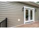 Back exterior with wood-look siding, glass doors, deck, and modern exterior lighting at 0 6Th Nw St, Hickory, NC 28601