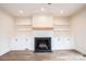 Close up of living room fireplace with built-in cabinets and shelving and a wood beam mantle at 0 6Th Nw St, Hickory, NC 28601