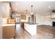 Kitchen featuring an island with stone countertops and modern pendant lighting, with a gas range at 0 6Th Nw St, Hickory, NC 28601