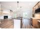Modern kitchen with a center island, stainless steel appliances, and a view of the living room at 0 6Th Nw St, Hickory, NC 28601
