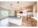 Kitchen featuring an island with stone countertops and modern pendant lighting, with wood floors at 0 6Th Nw St, Hickory, NC 28601