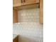 Close up of kitchen backsplash with light wooden cabinets at 0 6Th Nw St, Hickory, NC 28601