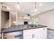 Modern kitchen island featuring a dark countertop, stainless steel dishwasher, and stylish pendant lighting at 0 6Th Nw St, Hickory, NC 28601