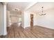 Spacious living room with wood floors, recessed lighting, and an open floor plan leading to the kitchen at 0 6Th Nw St, Hickory, NC 28601