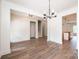 Open-concept living space with modern chandelier, neutral paint, and hardwood floors at 0 6Th Nw St, Hickory, NC 28601