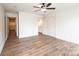 Spacious bedroom with a ceiling fan, wood-look flooring, and a doorway to an ensuite bathroom at 0 6Th Nw St, Hickory, NC 28601