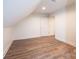 Bright room featuring hardwood floors, white walls, and angled ceiling at 0 6Th Nw St, Hickory, NC 28601