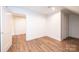 Spacious room with hardwood floors, white trim, and neutral wall color at 0 6Th Nw St, Hickory, NC 28601