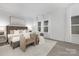 Serene bedroom with a plush bed, accent chairs, and ample natural light creates a relaxing and inviting atmosphere at 10053 Jack Nicklaus Dr # 932, Lancaster, SC 29720