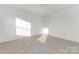Bright bedroom features neutral carpet, white walls, and ample natural light at 10053 Jack Nicklaus Dr # 932, Lancaster, SC 29720