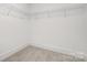 Spacious walk-in closet featuring neutral carpet and ample shelving at 10053 Jack Nicklaus Dr # 932, Lancaster, SC 29720
