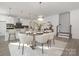 Stylish dining area adjacent to the kitchen with a modern table setting for six at 10053 Jack Nicklaus Dr # 932, Lancaster, SC 29720