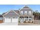 Beautiful two-story home with blue siding, white trim, and a welcoming front porch at 10053 Jack Nicklaus Dr # 932, Lancaster, SC 29720