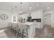 Modern kitchen featuring a large island with bar seating and stylish pendant lighting at 10053 Jack Nicklaus Dr # 932, Lancaster, SC 29720