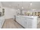 Bright, open kitchen featuring a center island, stainless steel appliances and hardwood floors at 10053 Jack Nicklaus Dr # 932, Lancaster, SC 29720