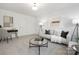 Inviting living room features a plush sofa, stylish coffee table, and modern decor, creating a welcoming ambiance at 10053 Jack Nicklaus Dr # 932, Lancaster, SC 29720