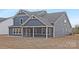 Charming rear exterior view of the home featuring a screened porch and craftsman-style details at 10053 Jack Nicklaus Dr # 932, Lancaster, SC 29720