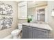 Bright bathroom featuring a granite topped vanity at 104 Bryant St, Belmont, NC 28012