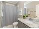 Bathroom featuring a shower/tub combo and a granite topped vanity at 104 Bryant St, Belmont, NC 28012