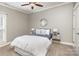 Bedroom with ceiling fan, carpeted floors, and neutral wall paint at 104 Bryant St, Belmont, NC 28012