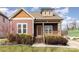 Charming home featuring a welcoming front porch with brick steps and meticulously maintained landscaping at 104 Bryant St, Belmont, NC 28012