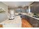 Spacious kitchen featuring a large island, stainless steel appliances, and hardwood floors at 104 Bryant St, Belmont, NC 28012