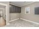 Laundry room with tile flooring, upper cabinets and a window at 104 Bryant St, Belmont, NC 28012