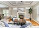 A bright living room with hardwood floors, a fireplace and elegant decor at 104 Bryant St, Belmont, NC 28012