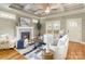 Comfortable living room with a decorative ceiling fan, fireplace and hardwood floors at 104 Bryant St, Belmont, NC 28012