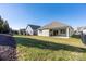 Well-maintained backyard featuring a covered patio, lush green lawn, and privacy fencing, perfect for outdoor enjoyment at 106 Chase Water Dr, Mooresville, NC 28117