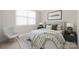 Bright bedroom with a large window, a gray rug, and side tables at 106 Chase Water Dr, Mooresville, NC 28117