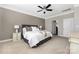 Comfortable bedroom with a ceiling fan, neutral paint, carpet, and stylish furnishings offer a relaxing space at 106 Chase Water Dr, Mooresville, NC 28117