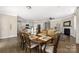 Dining area with hardwood floors, leading to a modern kitchen and living room, great for entertaining at 106 Chase Water Dr, Mooresville, NC 28117