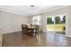 Dining room with hardwood floors and sliding doors that provide access to a private backyard at 106 Chase Water Dr, Mooresville, NC 28117