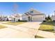 Charming one-story home with landscaped front yard, long driveway, and attached two car garage at 106 Chase Water Dr, Mooresville, NC 28117