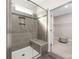 This bathroom shower features a glass door, a built-in seat, and a niche at 106 Chase Water Dr, Mooresville, NC 28117