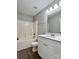 Bathroom features a shower-tub combo and a vanity with bright white cabinets at 11339 Fox Hill Dr, Charlotte, NC 28269