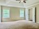 Spacious bedroom with trey ceilings, carpet, and natural light at 11339 Fox Hill Dr, Charlotte, NC 28269