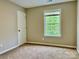 Bedroom with a window and a door at 11339 Fox Hill Dr, Charlotte, NC 28269