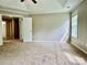 Spacious carpeted bedroom with ample natural light and neutral wall paint at 11339 Fox Hill Dr, Charlotte, NC 28269