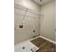 Laundry room with utility hook ups and wire rack shelving at 11339 Fox Hill Dr, Charlotte, NC 28269